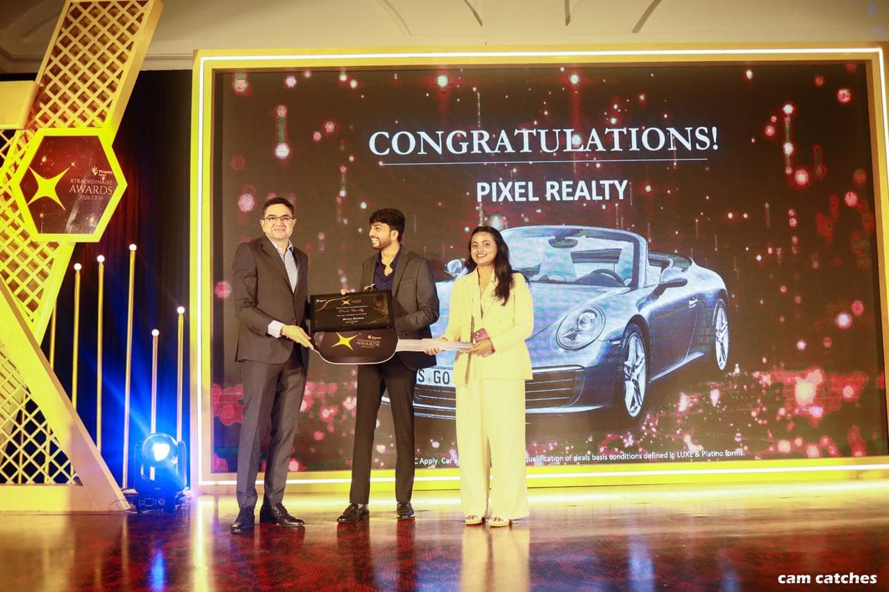 Pixel Realty receiving an award recognition on stage